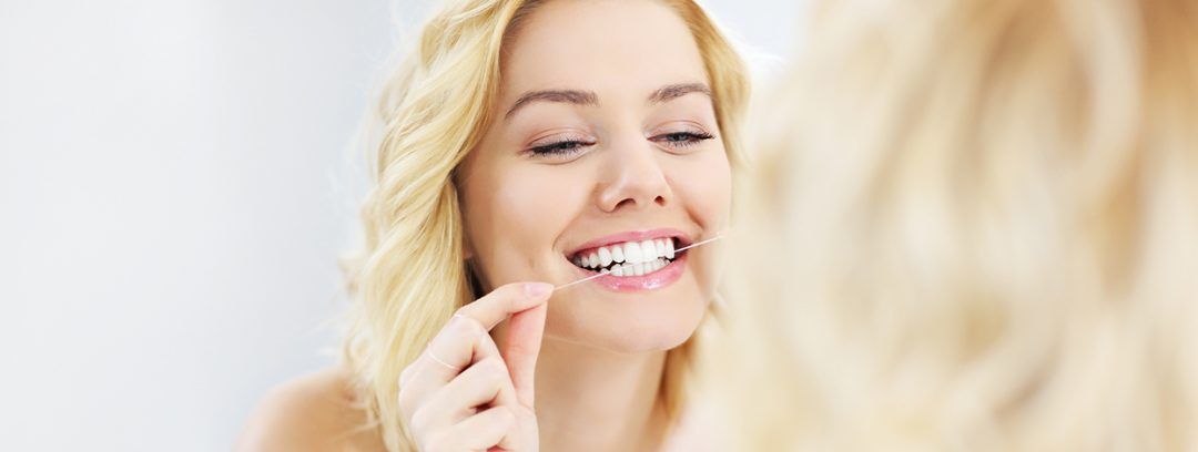 Is Flossing the Way to Avoid Needing Dental Implant in Kent?